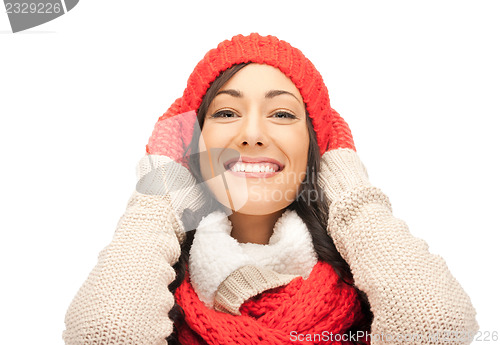 Image of beautiful woman in hat, muffler and mittens