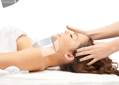 Image of beautiful woman in massage salon