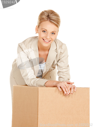 Image of attractive businesswoman with cardboard box