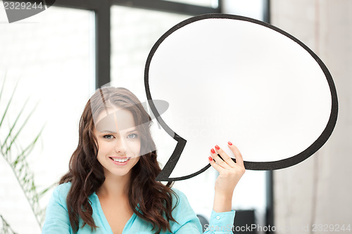Image of smiling woman with blank text bubble