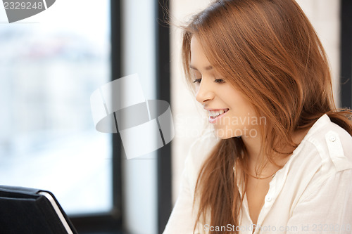 Image of happy woman with tablet pc computer