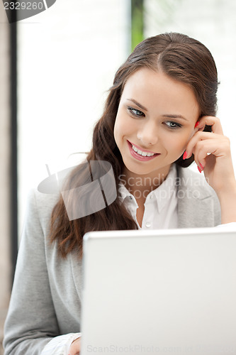 Image of happy woman with laptop computer