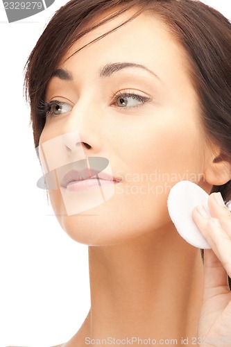 Image of beautiful woman with cotton pad