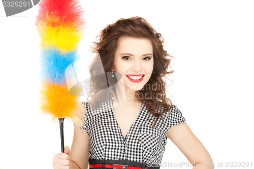 Image of beautiful woman with cleaning sweep