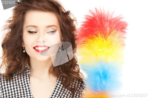 Image of beautiful woman with cleaning sweep