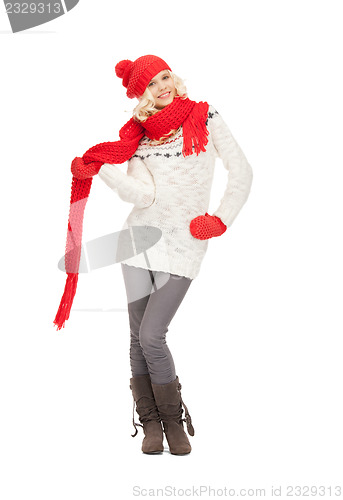 Image of beautiful woman in hat, muffler and mittens