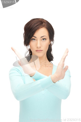 Image of woman making stop gesture