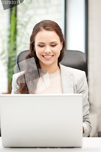 Image of happy woman with laptop computer