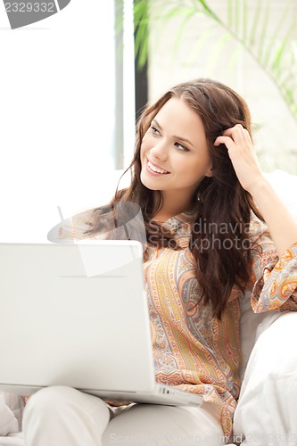 Image of happy woman with laptop computer
