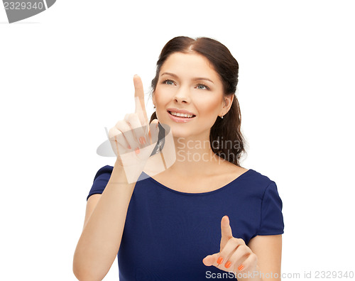Image of businesswoman working with something imaginary