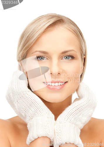 Image of beautiful woman in mittens
