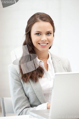 Image of happy woman with laptop computer