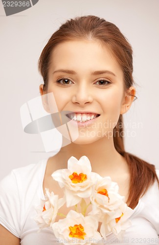 Image of beautiful woman with white flower