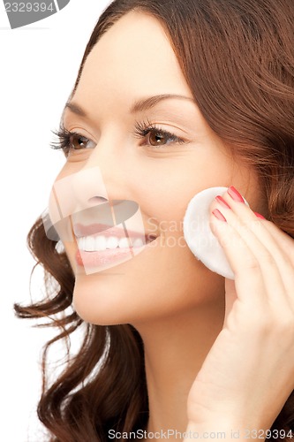 Image of beautiful woman with cotton pad
