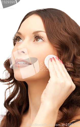 Image of beautiful woman with cotton pad