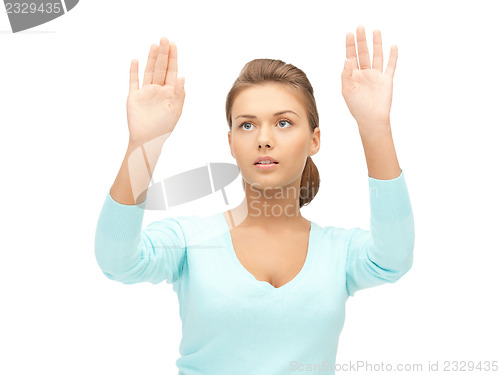 Image of businesswoman working with something imaginary