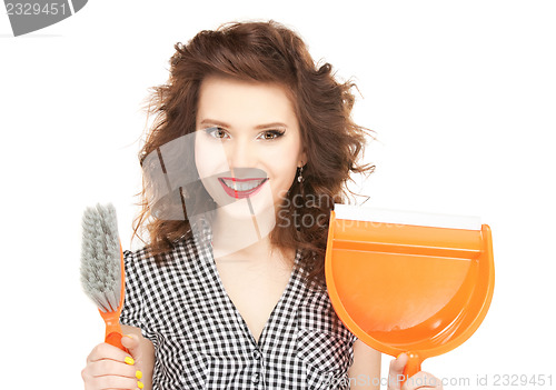 Image of beautiful woman with cleaning sweep