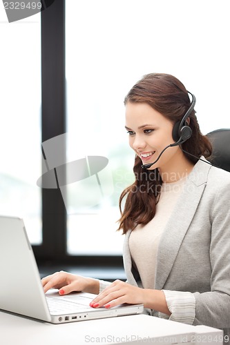 Image of helpline operator with laptop computer