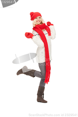 Image of beautiful woman in hat, muffler and mittens