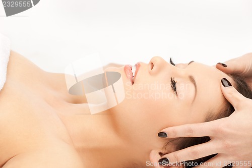 Image of beautiful woman in massage salon