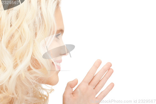 Image of woman whispering gossip