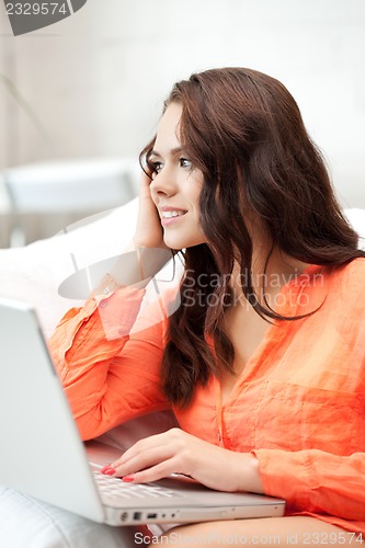 Image of happy woman with laptop computer