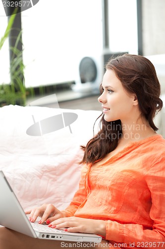 Image of happy woman with laptop computer