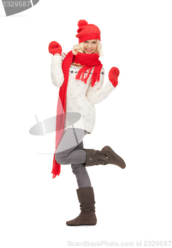 Image of beautiful woman in hat, muffler and mittens