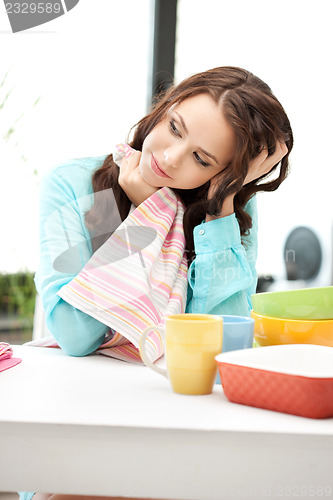 Image of lovely housewife at the kitchen