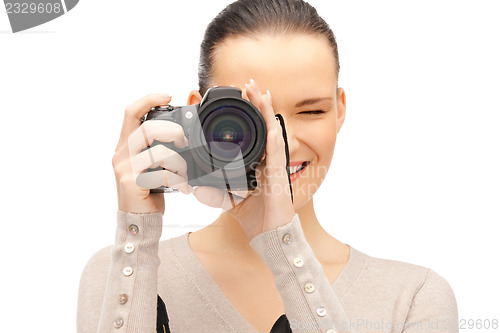 Image of teenage girl with digital camera