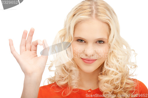 Image of lovely teenage girl showing ok sign