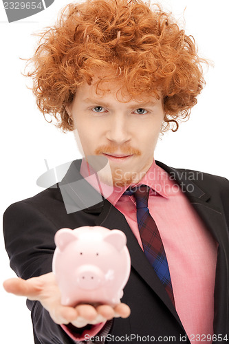 Image of man with piggy bank