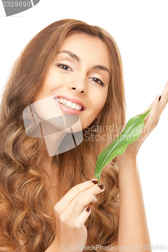 Image of woman with green leaf