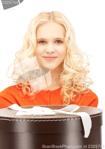 Image of happy teenage girl with gift box