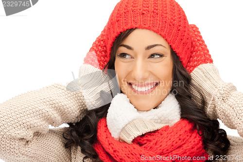 Image of beautiful woman in hat, muffler and mittens