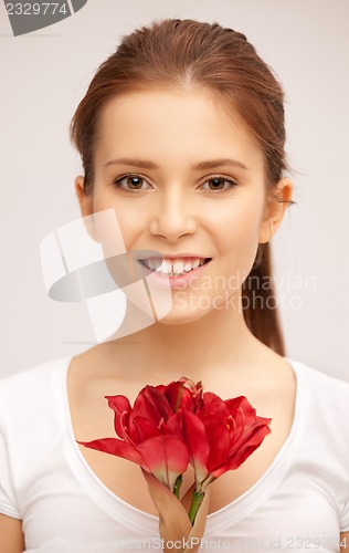 Image of beautiful woman with red flower