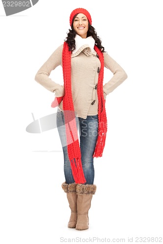 Image of beautiful woman in hat, muffler and mittens