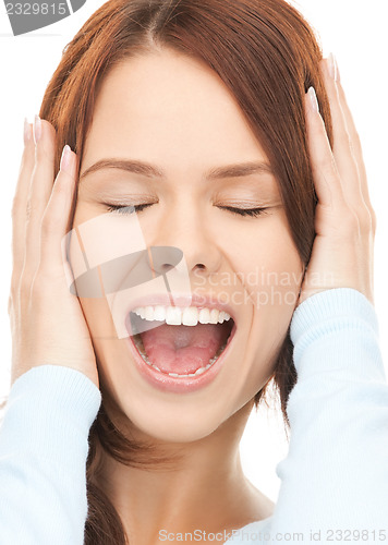 Image of woman with hands on ears