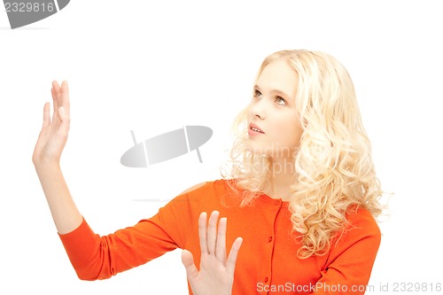 Image of businesswoman working with something imaginary