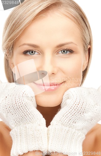 Image of beautiful woman in mittens