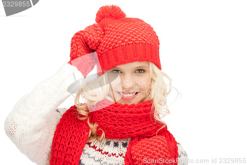 Image of beautiful woman in hat, muffler and mittens