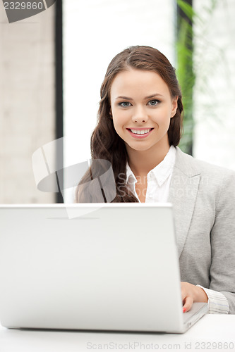 Image of happy woman with laptop computer