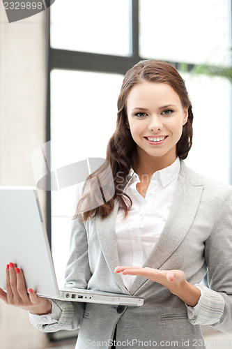 Image of happy woman with laptop computer