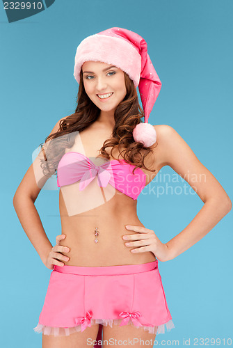 Image of cheerful santa helper girl in lingerie