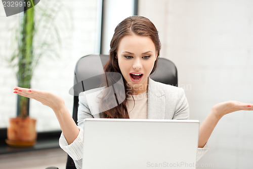 Image of happy woman with laptop computer