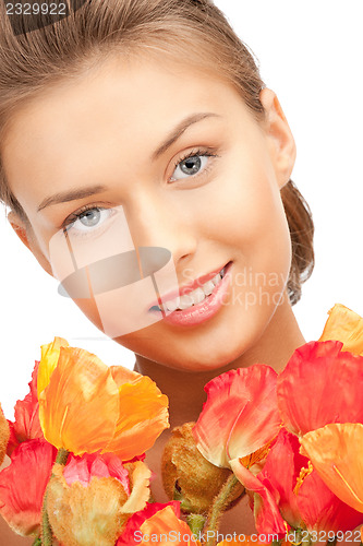 Image of lovely woman with red flowers