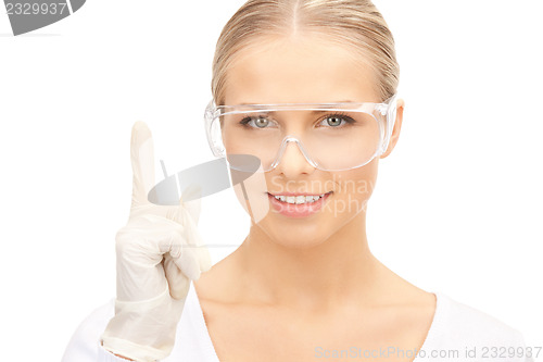 Image of woman in protective glasses and gloves