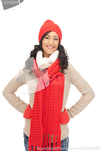 Image of beautiful woman in hat, muffler and mittens