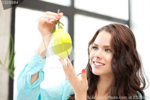 Image of lovely woman with lemon