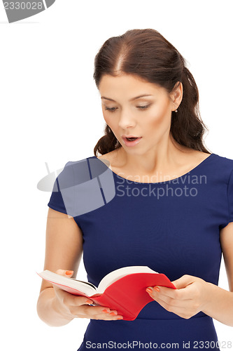 Image of surprised woman with book